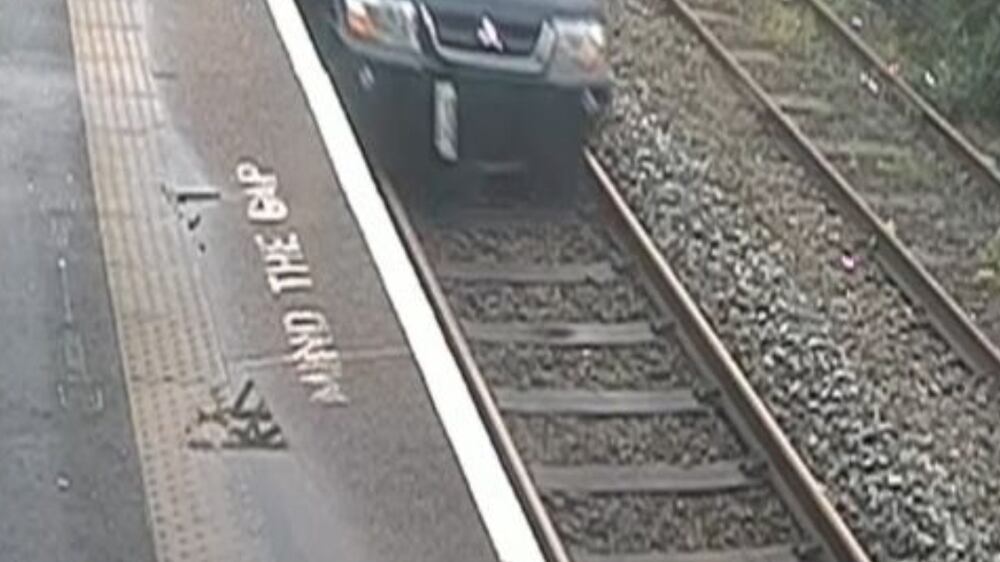 CCTV shows 'idiotic' motorist driving on railway track