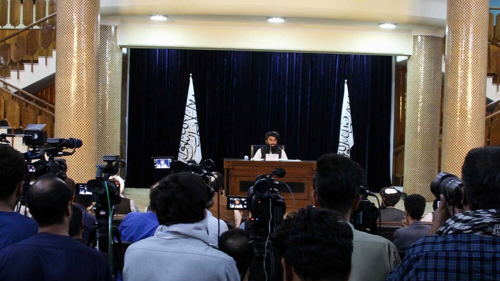 Zabhiullah Mujahid, the Taliban spokesperson, talks with journalists as he announces the interim government and declaring the country as an Islamic Emirate, during a press conference in Kabul, Afghanistan, 07 September 2021.  Mujahid said the government will be led by Mullah Mohammad Hassan Akhund, with Sarajuddin Haqqani as the Interior Minister.  Mullah Yaqoob as acting Defence Minister, Amir Khan Muttaqi as acting Foreign Minister, and Taliban co-founder Mullah Abdul Ghani Baradar and Mullah Abdul Salam Hanafi as two deputies.   EPA / STRINGER