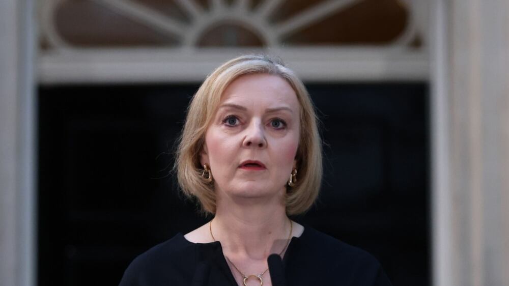 Liz Truss, UK prime minister, makes a statement following the death of Queen Elizabeth II outside 10 Downing Street in London, UK, on Thursday, Sept.  8, 2022.  Queen Elizabeth II, whose reign took Britain from the age of steam to the era of the smartphone, and who oversaw the largely peaceful breakup of an empire that once spanned the globe, has died. Photographer: Hollie Adams / Bloomberg