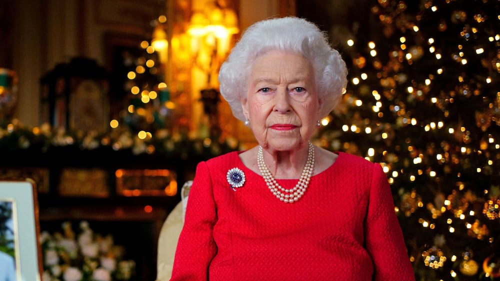 FILE - In this undated photo issued on Dec.  23, 2021, Britain's Queen Elizabeth II records her annual Christmas broadcast in Windsor Castle, Windsor, England.  The United Kingdom will celebrate Queen Elizabeth II’s 70 years on the throne with a military parade, neighborhood parties and a competition to create a new dessert for the Platinum Jubilee, Buckingham Palace said Monday, Jan.  10, 2022.  (Victoria Jones / Pool Photo via AP, File)