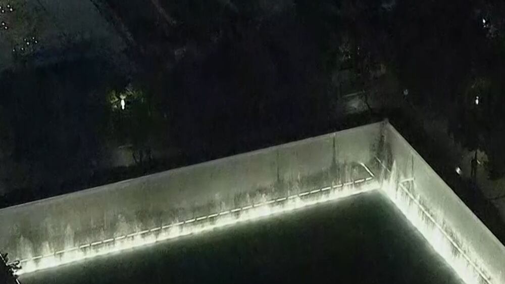9/11 memorial lit up as dawn breaks in New York