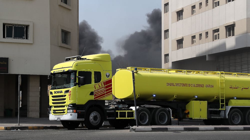 Fire broke out at a used cars spare parts warehouse in the Al Qusais Industrial Area 3 in Sharjah on 12 September,2021. Sharjah Civil Defence personals trying to control the fire. Pawan Singh/The National. 