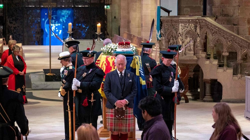Britain's King Charles III attends a Vigil at St Giles' Cathedral, in Edinburgh, on September 12, 2022, following the death of Queen Elizabeth II on September 8 as people walk past to pay their respect to before the coffin of her Majesty.  - Mourners will on September 12, 2022 get the first opportunity to pay respects before the coffin of Queen Elizabeth II, as it lies in an Edinburgh cathedral where King Charles III will preside over a vigil.  (Photo by Jane Barlow  /  POOL  /  AFP)