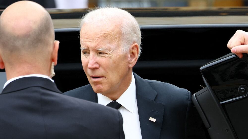 LONDON, ENGLAND - SEPTEMBER 19: U.S. President Joe Biden exits a car outside the Westminster Abbey, on the day of the state funeral and attend the state funeral and burial of Queen Elizabeth II in Westminster Abbey,  September 19, 2022 in London, England.  / (Photo by Hannah McKay - WPA Pool / Getty Images)