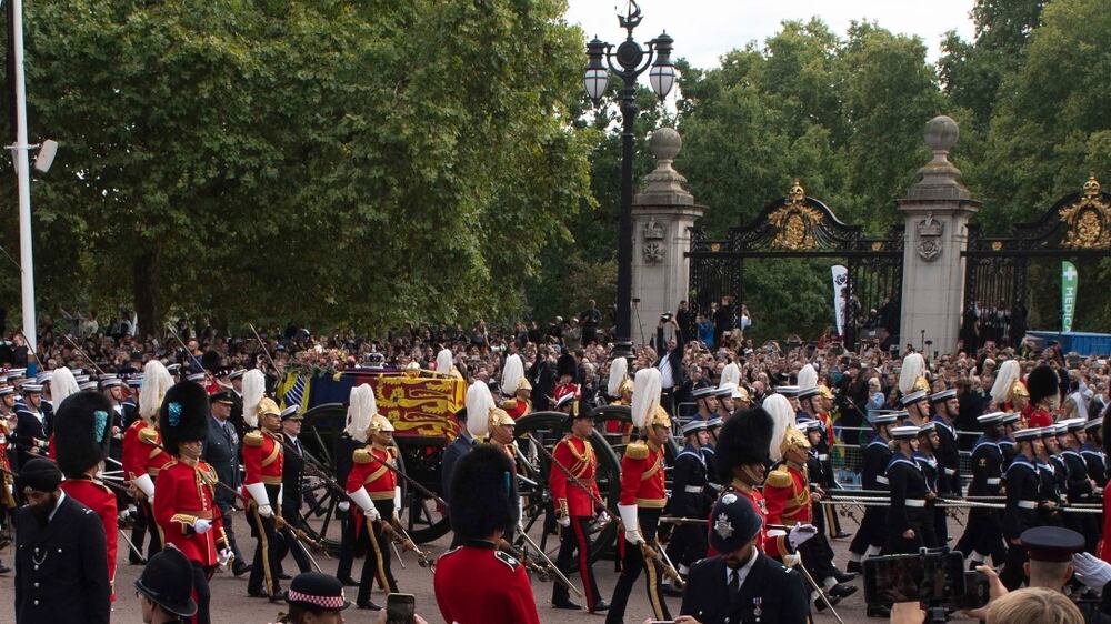 The Royal Household Cavalry and members of the Navy pull the coffin of Britain's Queen Elizabeth II during the State Funeral Procession in London, Britain, 19 September 2022.  Britain's Queen Elizabeth II died at her Scottish estate, Balmoral Castle, on 08 September 2022.  The 96-year-old Queen was the longest-reigning monarch in British history.   EPA / NEIL HALL