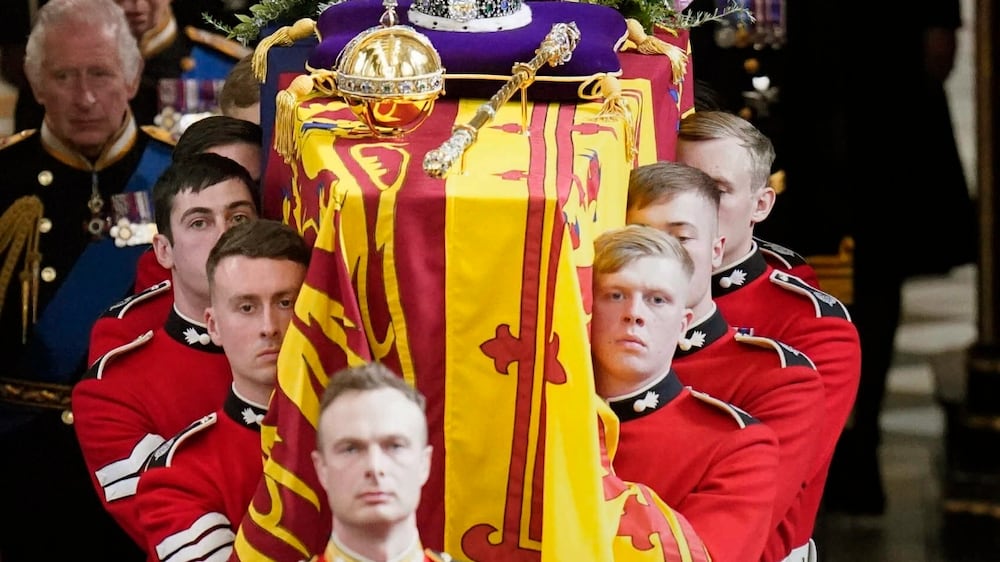 King Charles III and members of the Royal family follow behind the coffin of Queen Elizabeth II, draped in the Royal Standard with the Imperial State Crown and the Sovereign's orb and sceptre, as it is carried out of Westminster Abbey after her State Funeral, in London, Monday Sept.  19, 2022.  The Queen, who died aged 96 on Sept.  8, will be buried at Windsor alongside her late husband, Prince Philip, who died last year.  (Danny Lawson / Pool Photo via AP)