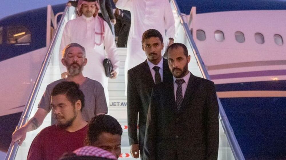 10 prisoners of war (five British citizens, one Moroccan, one Swedish, one Croatian, and two Americans) are seen arriving, following successful mediation efforts by Saudi Arabia's Crown Prince Mohammed bin Salman, from Russia to King Khalid International Airport, in Riyadh, Saudi Arabia, September 21, 2022.  Saudi Press Agency / Handout via REUTERS ATTENTION EDITORS - THIS PICTURE WAS PROVIDED BY A THIRD PARTY