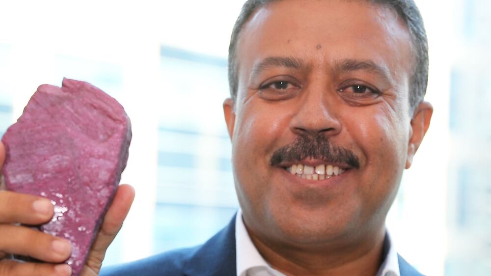 Esmail Borhanzahi showing the 40 years old Ruby believed to be the world’s largest and was owned by an Afghan village during the unveiling of the ruby stone at Business Bay in Dubai. Pawan Singh / The National