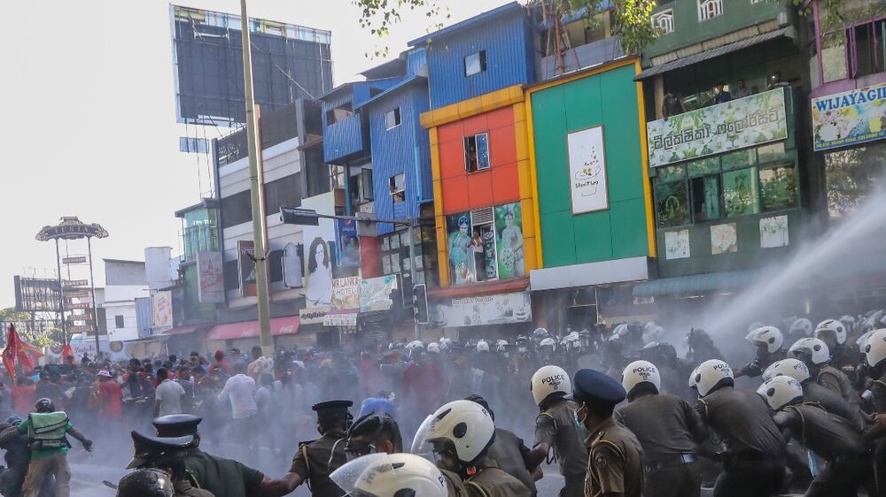 Policemen use tear gas and water cannons to disperse an anti-government protest march in Colombo, Sri Lanka, 24 September 2022.  Protests have been affecting the country for over six months as Sri Lanka faces its worst-ever economic crisis in decades due to a lack of foreign reserves, resulting in severe shortages in food, fuel, medicine, and imported goods.   EPA / CHAMILA KARUNARATHNE
