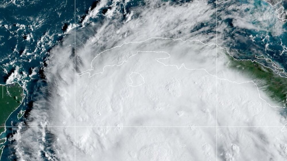 This National Oceanic and Atmospheric Administration (NOAA) satellite handout image shows tropical storm Ian over the Central Caribbean, on September 26, 2022 at 13:30 UTC.  - Tropical storm Ian has strengthened into a Category 1 hurricane as it nears western Cuba, the US National Hurricane Center (NHC) said on September 26, 2022.  (Photo by Handout  /  NOAA / RAMMB  /  AFP)  /  RESTRICTED TO EDITORIAL USE - MANDATORY CREDIT "AFP PHOTO  /  RAMMB / NOAA" - NO MARKETING NO ADVERTISING CAMPAIGNS - DISTRIBUTED AS A SERVICE TO CLIENTS