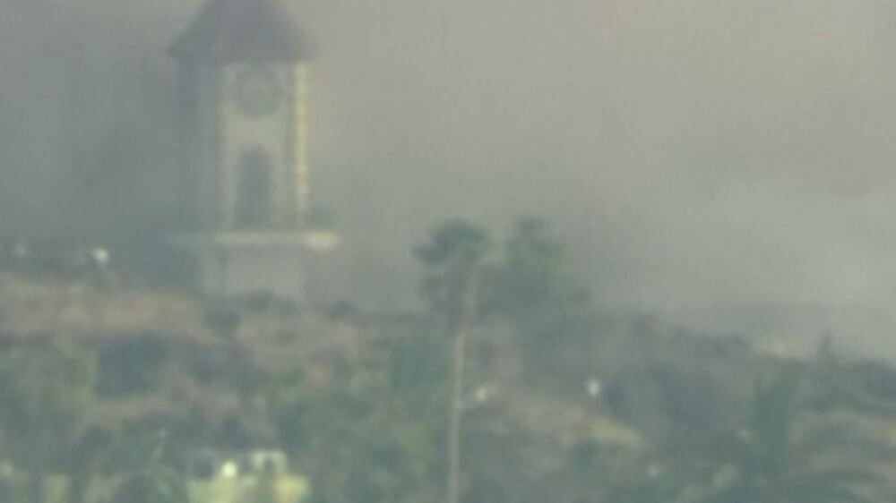 Dramatic moment lava from La Palma volcano collapses church tower