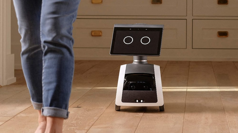 This handout image courtesy of Amazon. com, Inc.  released September 29, 2021, shows the camera-equipped home robot "Astro" following a person at home.  - Amazon revealed on Tuesday a camera-equipped home robot that users can deploy to patrol their houses, a device that one of the project's developers called making science fiction a reality. 
The tech giant cheered the "Astro" robot as a breakthrough for security and convenience, but digital watchdogs raised concerns for potential risks to people's most private moments at home. 
Astro is a roughly two-feet (60 centimeter) tall and 20-pound (nine-kilo) device that can map out a house floor plan and obey commands to go to a specific place to take a closer look with its telescoping camera.  (Photo by - / Amazon / AFP) / RESTRICTED TO EDITORIAL USE - MANDATORY CREDIT "AFP PHOTO / Amazon. com, Inc.  " - NO MARKETING - NO ADVERTISING CAMPAIGNS - DISTRIBUTED AS A SERVICE TO CLIENTS