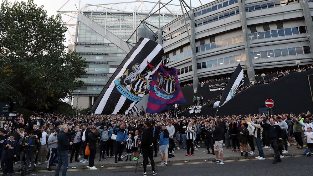 Newcastle United supporters celebrate outside St.  James' Park in Newcastle Upon Tyne, England Thursday Oct.  7, 2021.  English Premier League club Newcastle has been sold to Saudi Arabia���s sovereign wealth fund after a protracted takeover and legal fight involving concerns about piracy and rights abuses in the kingdom.  (AP Photo / Scott Heppell)