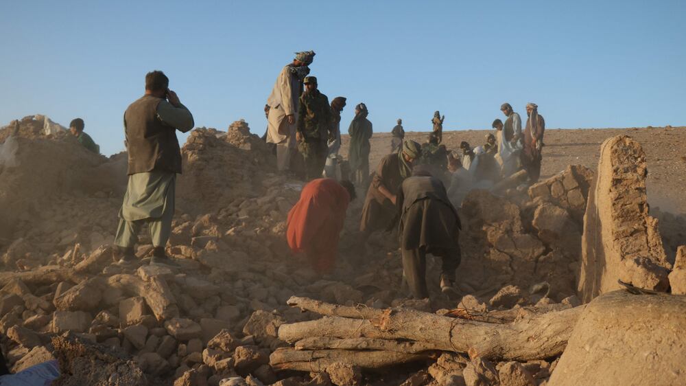 Residents of quake-hit Afghan village search for relatives through rubble