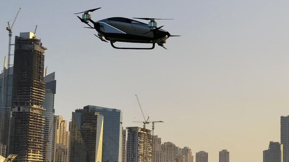 A handout picture provided by the Dubai Chambers on October 10, 2022, shows the X2, a two-seater electric flying car developed by Chinese e-vehicle manufacturer XPENG AEROHT, during its unveiling at Dubai's GITEX tech show in the Gulf emirate.  (Photo by Dubai Chambers  /  AFP)  /  RESTRICTED TO EDITORIAL USE - MANDATORY CREDIT "AFP PHOTO /  DUBAI CHAMBERS" - NO MARKETING NO ADVERTISING CAMPAIGNS - DISTRIBUTED AS A SERVICE TO CLIENTS