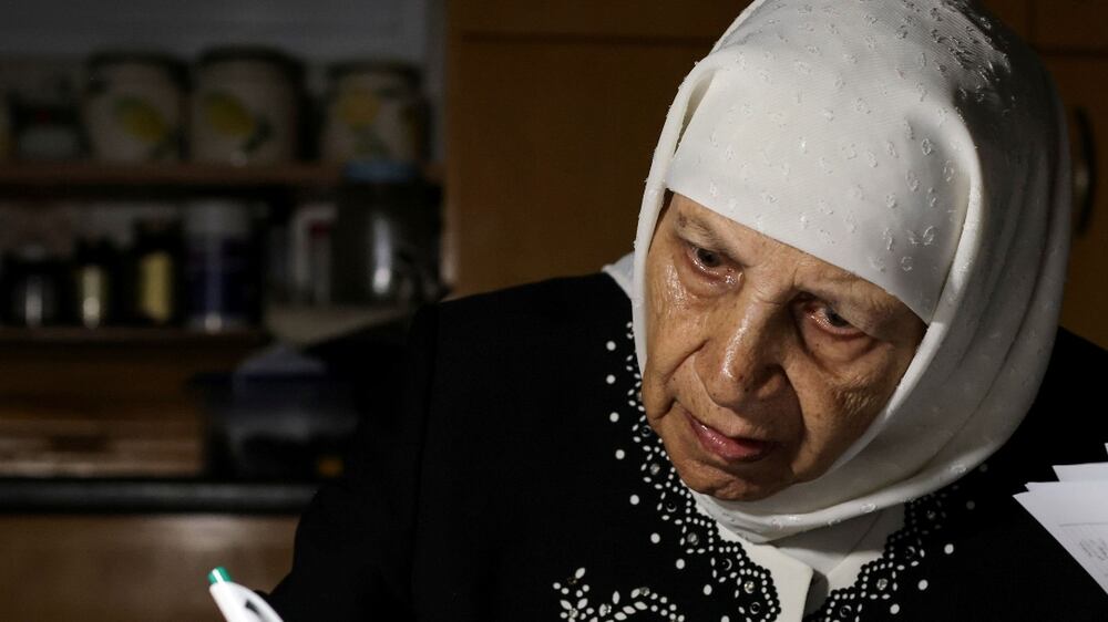 Palestinian grandmother Jihad Butto, 85, reviews her university notes, after obtaining a bachelor's degree in religious studies, at her home in Nazareth, Israel October 8, 2021.  Picture taken on October 8, 2021.  REUTERS / Ammar Awad     TPX IMAGES OF THE DAY