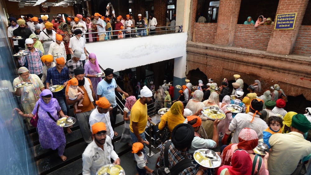 The world's largest free kitchen at Punjab's Golden Temple feeds 100,000 a day