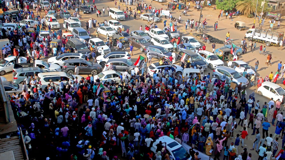 People attend demonstrations in support of the civilian government, in Khartoum, Sudan, 21 October 2021.  Thousands of people marched during a demonstration called by the Alliance of Forces for Freedom and Change, the Central Council Group to support the government of Abdullah Hamdok, while the army and police forces closed the roads leading to government headquarters and main markets.   EPA / MOHAMMED ABU OBAID