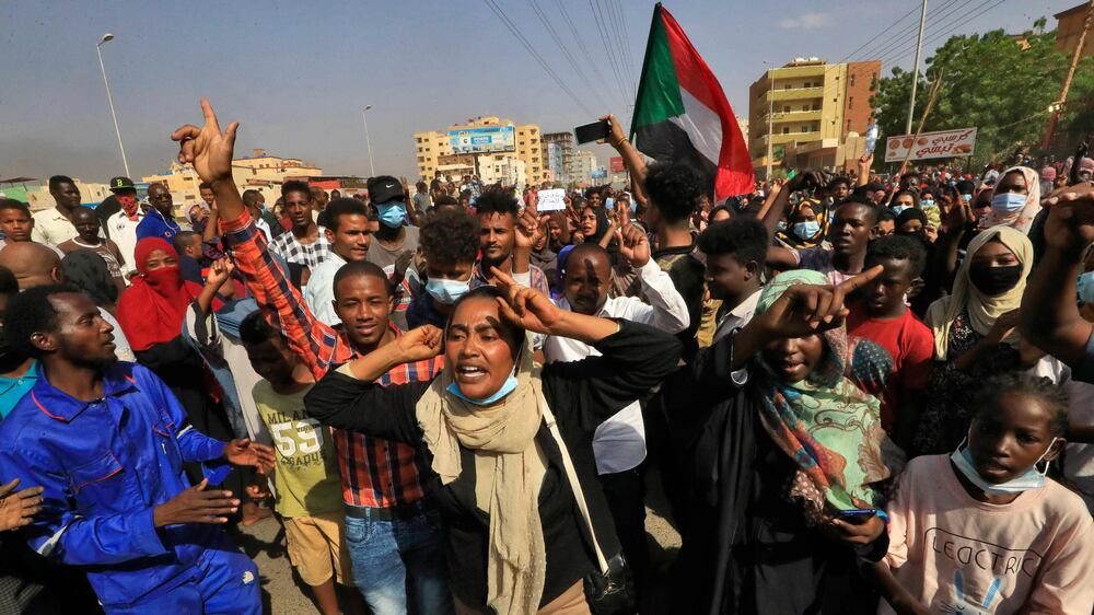 Sudanese protesters block streets and burn tyres after alleged coup