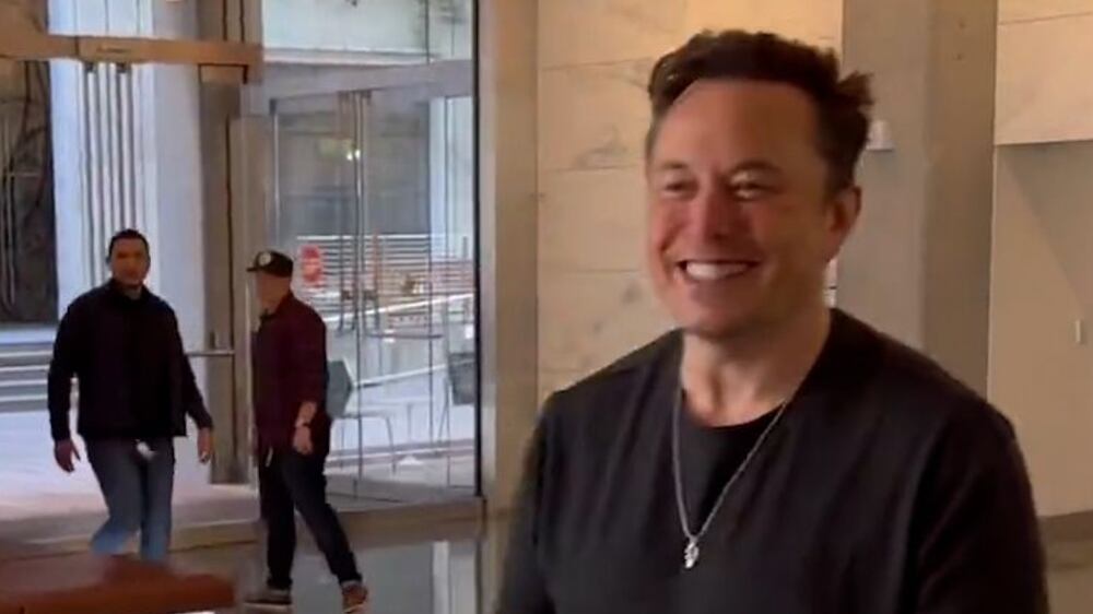 This image from the Twitter page of Elon Musk shows Musk entering Twitter headquarters carrying a sink through the lobby area on Wednesday, Oct.  26, 2022 in San Francisco.   Musk posted a video Wednesday showing him strolling into Twitter headquarters ahead of a Friday deadline to close his $44 billion deal to buy the company.   (Twitter page of Elon Musk via AP)