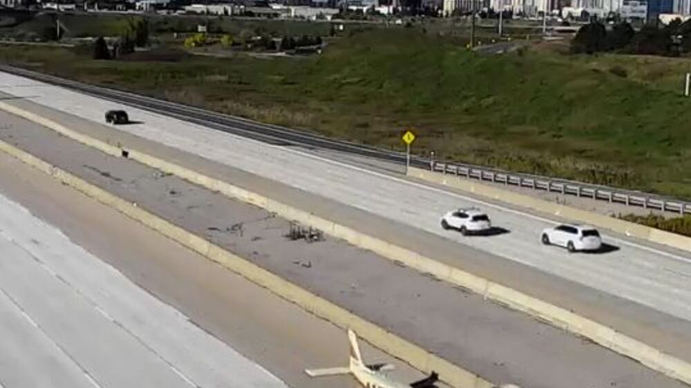 Surveillance footage shows plane landing on motorway in Toronto