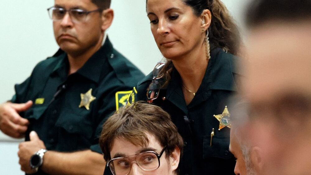 Marjory Stoneman Douglas High School shooter Nikolas Cruz is escorted from the courtroom after his sentencing at the Broward County Courthouse in Fort Lauderdale on November 2, 2022.  - Cruz, who pleaded guilty to 17 counts of premeditated murder in the 2018 shootings, is the most lethal mass shooter to stand trial in the US.  The hearing concluded today, November 2, 2022 when Circuit Judge Elizabeth Scherer sentenced Parkland school shooter Nikolas Cruz to life in prison without parole.  (Photo by Amy Beth Bennett  /  POOL  /  AFP)