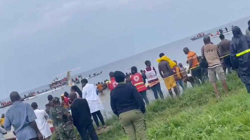 People look at Precision Air plane that crushed into Lake Victoria, Tanzania, November 6, 2022, in this still image obtained from a social media video.  Kanyika/ @startvtanzania1/via REUTERS  THIS IMAGE HAS BEEN SUPPLIED BY A THIRD PARTY.  MANDATORY CREDIT.  NO RESALES.  NO ARCHIVES. 