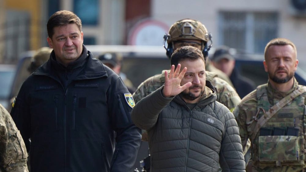 In this photo provided by the Ukrainian Presidential Press Office and posted on Facebook, Ukrainian President Volodymyr Zelenskyy gestures during his visit to Kherson, Ukraine, Monday, Nov.  14, 2022.  (Ukrainian Presidential Press Office via AP)