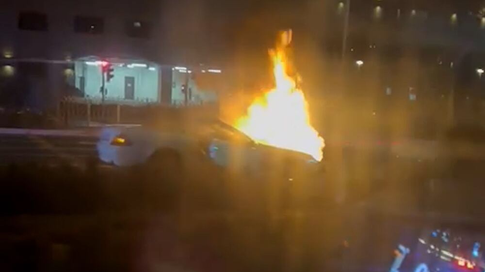 White convertible catches fire on The Palm