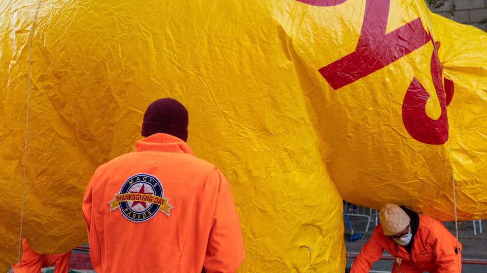 NEW YORK, NY - NOVEMBER 24: The Macy's inflation team works on balloons as they prepare ahead of the Macy's Thanksgiving Day Parade on November 24, 2021 in New York City.  Macy's prepares to celebrate it's 95th Thanksgiving Day Parade amid the COVID-19 pandemic.   David Dee Delgado / Getty Images / AFP
