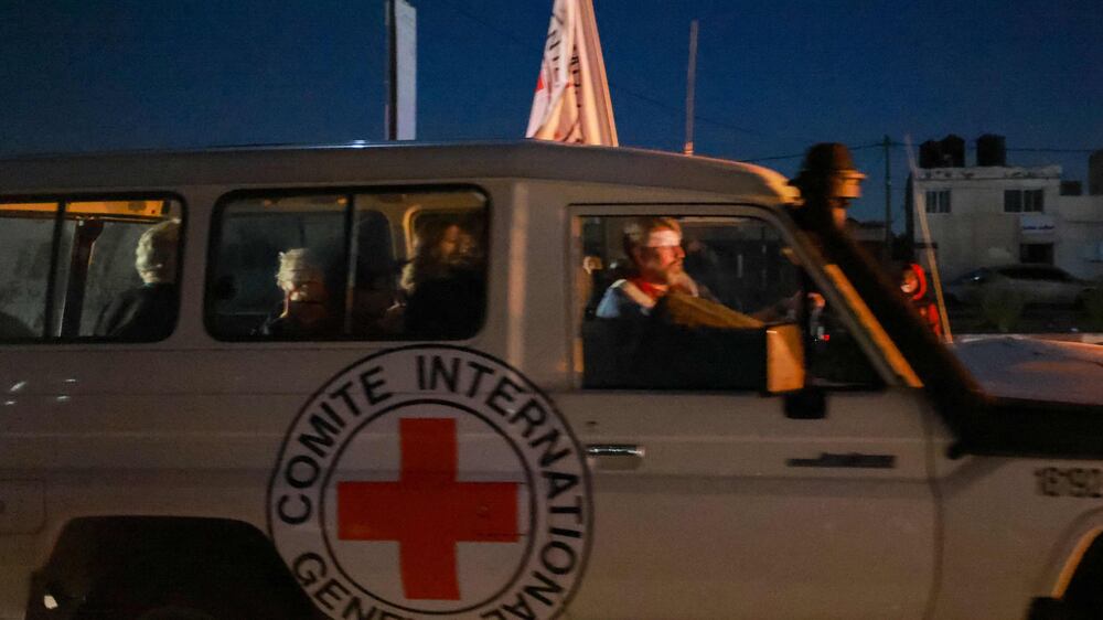 Released hostages arrive at Egypt's Rafah crossing inside Red Cross vehicles