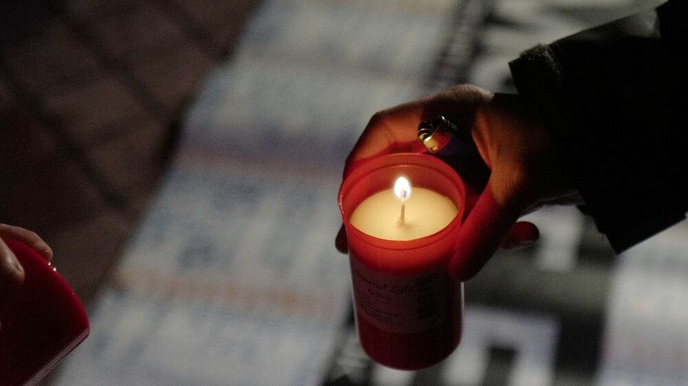 A candlelit vigil in Calais was held for migrants killed crossing the English Channel