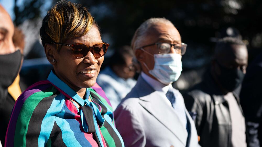 BRUNSWICK, GA - NOVEMBER 24: Wanda Cooper-Jones, mother of Ahmaud Arbery, arrives at the Glynn County Courthouse with Rev.  Al Sharpton as the jury deliberates in the trial of the killers of Ahmaud Arbery on November 24, 2021 in Brunswick, Georgia.  Greg McMichael, his son Travis McMichael, and a neighbor, William "Roddie" Bryan were found guilty in the February, 2020 fatal shooting of 25-year-old Ahmaud Arbery.    Sean Rayford / Getty Images / AFP
