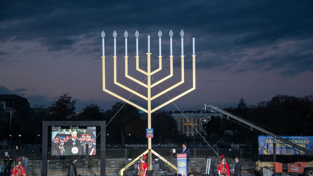 Rabbi Levi Shemtov, Executive Vice President of American Friends of Lubavitch (Chabad) looks on as a recording of then-United States Vice President Joe Biden��������s remarks at the 2016 National Menorah Lighting is shown prior to lighting the National Menorah on the Ellipse in Washington, DC, USA, 28 November 2021.   EPA / Ron Sachs  /  POOL