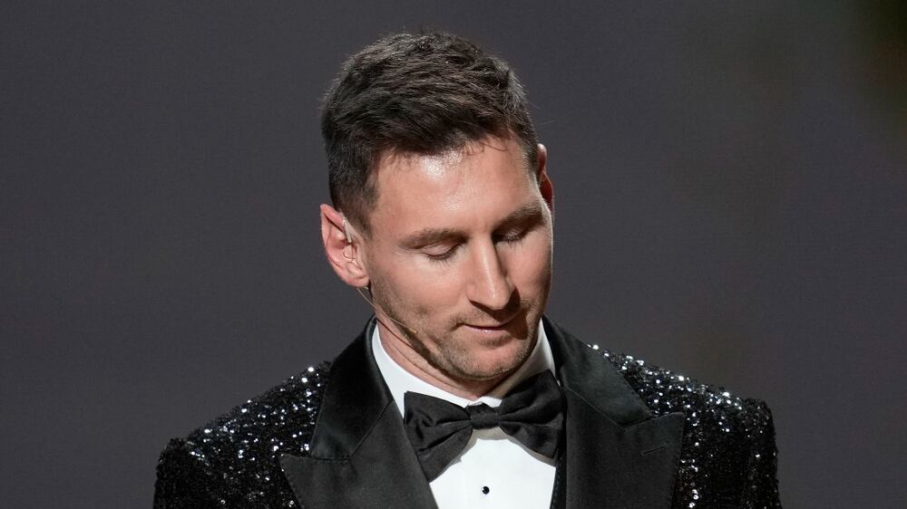 PSG player Lionel Messi reacts after winning the 2021 Ballon d'Or trophy during the 65th Ballon d'Or ceremony at Theatre du Chatelet, in Paris, Monday, Nov.  29, 2021.  Messi won the Ballon d'Or for seventh time.  (AP Photo / Christophe Ena)