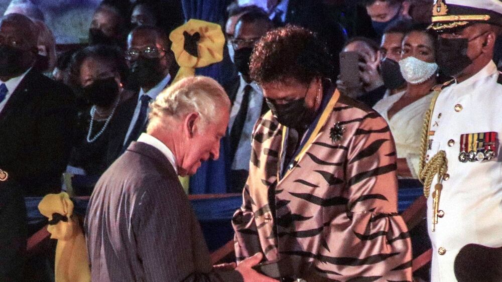 Barbados' new President Sandra Mason, center right, awards Prince Charles with the Order of Freedom of Barbados during the presidential inauguration ceremony in Bridgetown, Barbados on Tuesday Nov.  30, 2021.  Barbados stopped pledging allegiance to Queen Elizabeth II on Tuesday as it shed another vestige of its colonial past and became a republic for the first time in history. (AP Photo  /  David McD Crichlow)