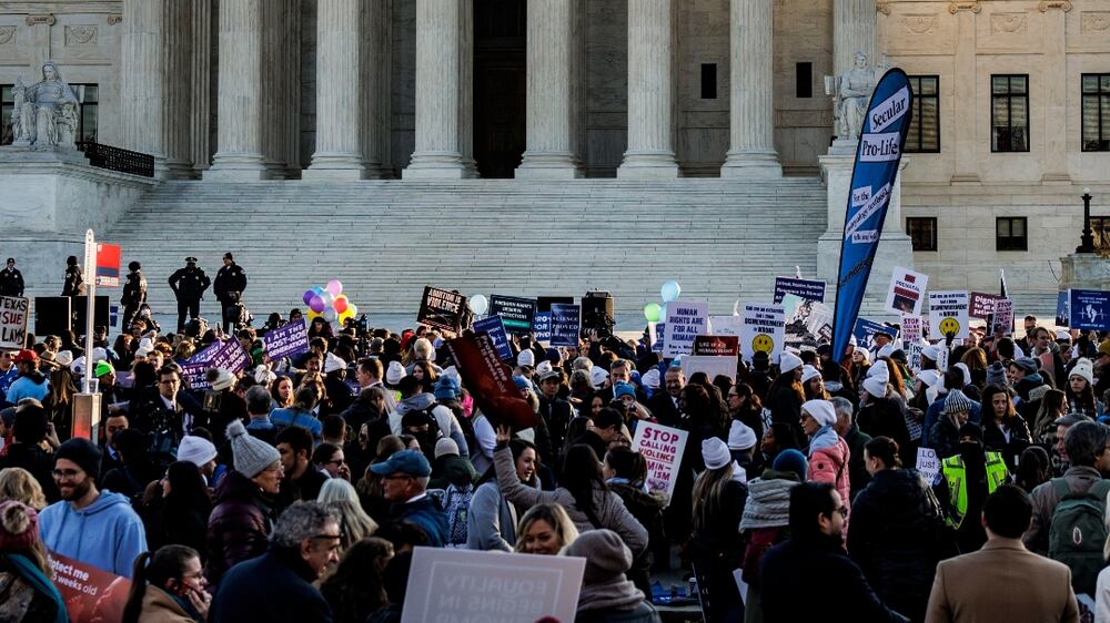 Pro Life and Pro Choice activists protests outside of the US Supreme Court as the high court prepares to hear arguments in a challenge to an abortion law in Mississippi that is a direct challenge to Roe v.  Wade in Washington, DC, USA, 01 December 2021.   EPA / SAMUEL CORUM
