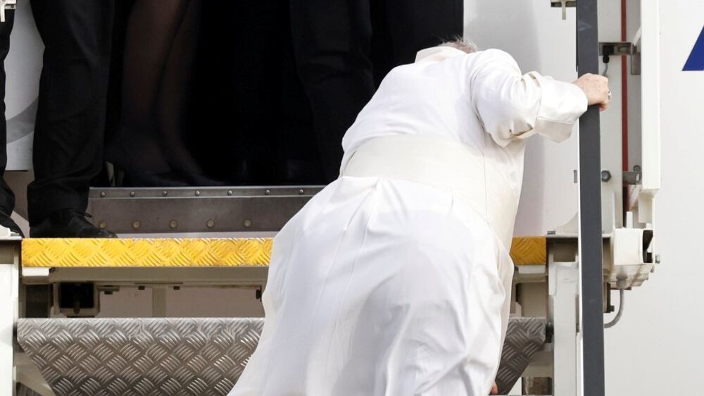 Pope Francis stumbles on plane steps before leaving Greece