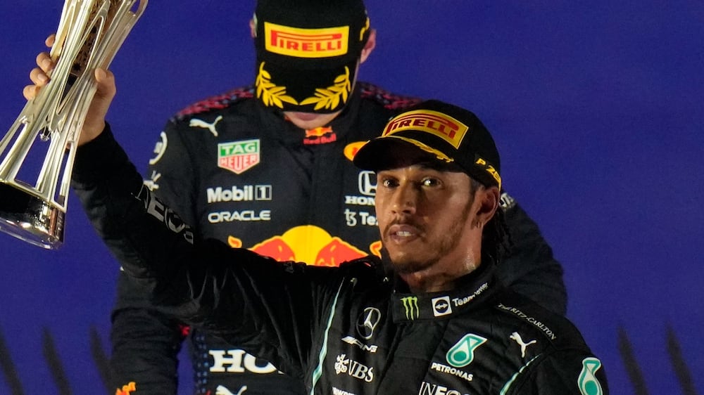 Mercedes driver Lewis Hamilton of Britain celebrates winning the Formula One Saudi Arabian Grand Prix in front of the second placed Red Bull driver Max Verstappen of the Netherlands, in Jiddah, Sunday, Dec.  5, 2021.  (AP Photo / Hassan Ammar)