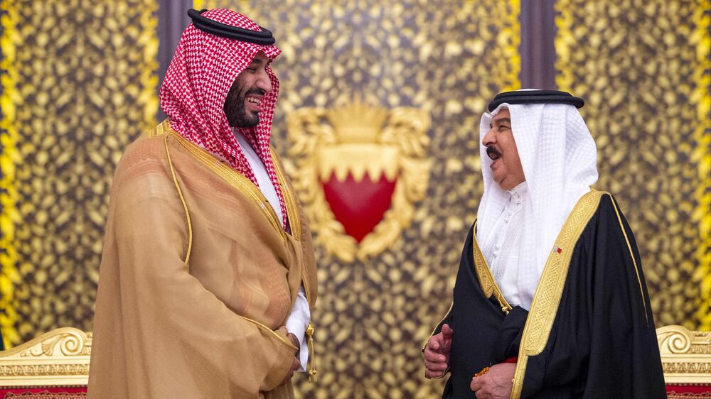 A handout picture released by the Saudi Royal Place shows Bahrain's King Hamad bin Isa al-Khalifa (R) welcoming Saudi Crown Prince Mohammed bin Salman (L) at the Sukheir Royal Palace in the capital Manama, on December 9, 2021.  (Photo by Bandar AL-JALOUD  /  Saudi Royal Palace  /  AFP)  /  == RESTRICTED TO EDITORIAL USE - MANDATORY CREDIT "AFP PHOTO  /  SAUDI ROYAL PALACE  /  byline " - NO MARKETING NO ADVERTISING CAMPAIGNS - DISTRIBUTED AS A SERVICE TO CLIENTS ==