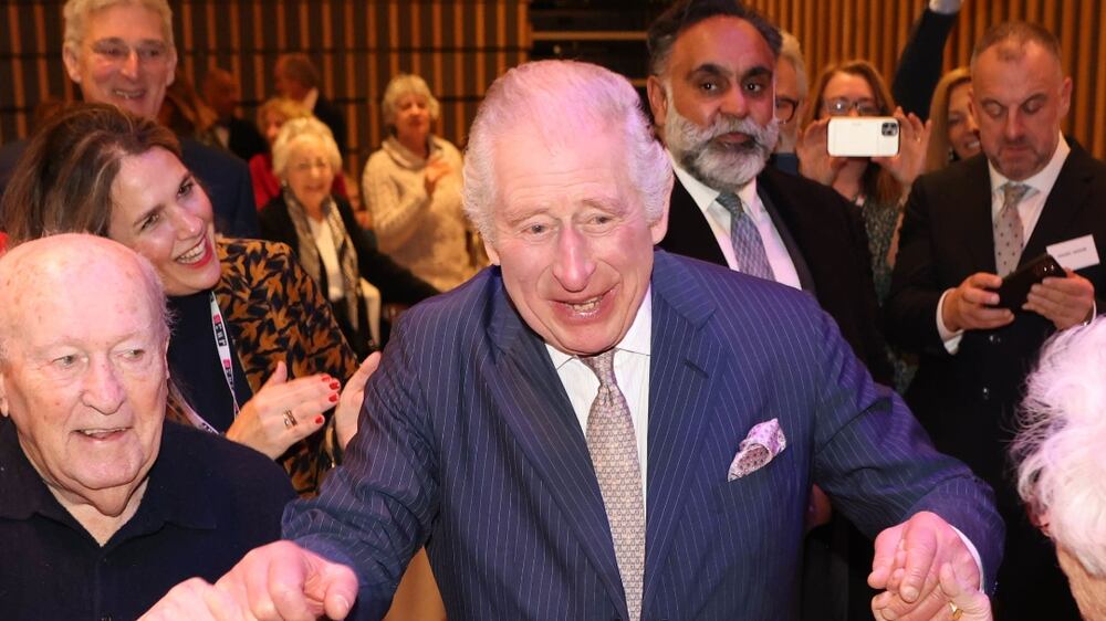 LONDON, ENGLAND - DECEMBER 16: King Charles III dances at a pre-Chanukah reception hosted on site for Holocaust survivors at the JW3 Community Centre on December 16, 2022 in London, England. Founded by Dame Vivien Duffield DBE, JW3 opened in October 2013 with a vision of a vibrant, diverse, unified British-Jewish community, inspired by and engaged with Jewish arts, culture, learning and life. (Photo by Ian Vogler - WPA Pool / Getty Images)