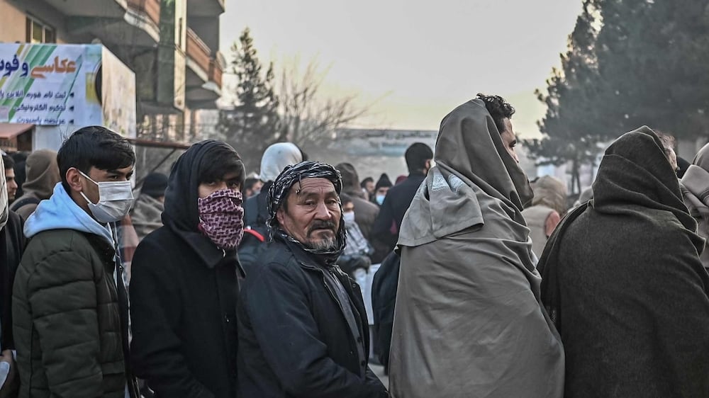 Hundreds of people queue for passports in Kabul in bid to leave Afghanistan.