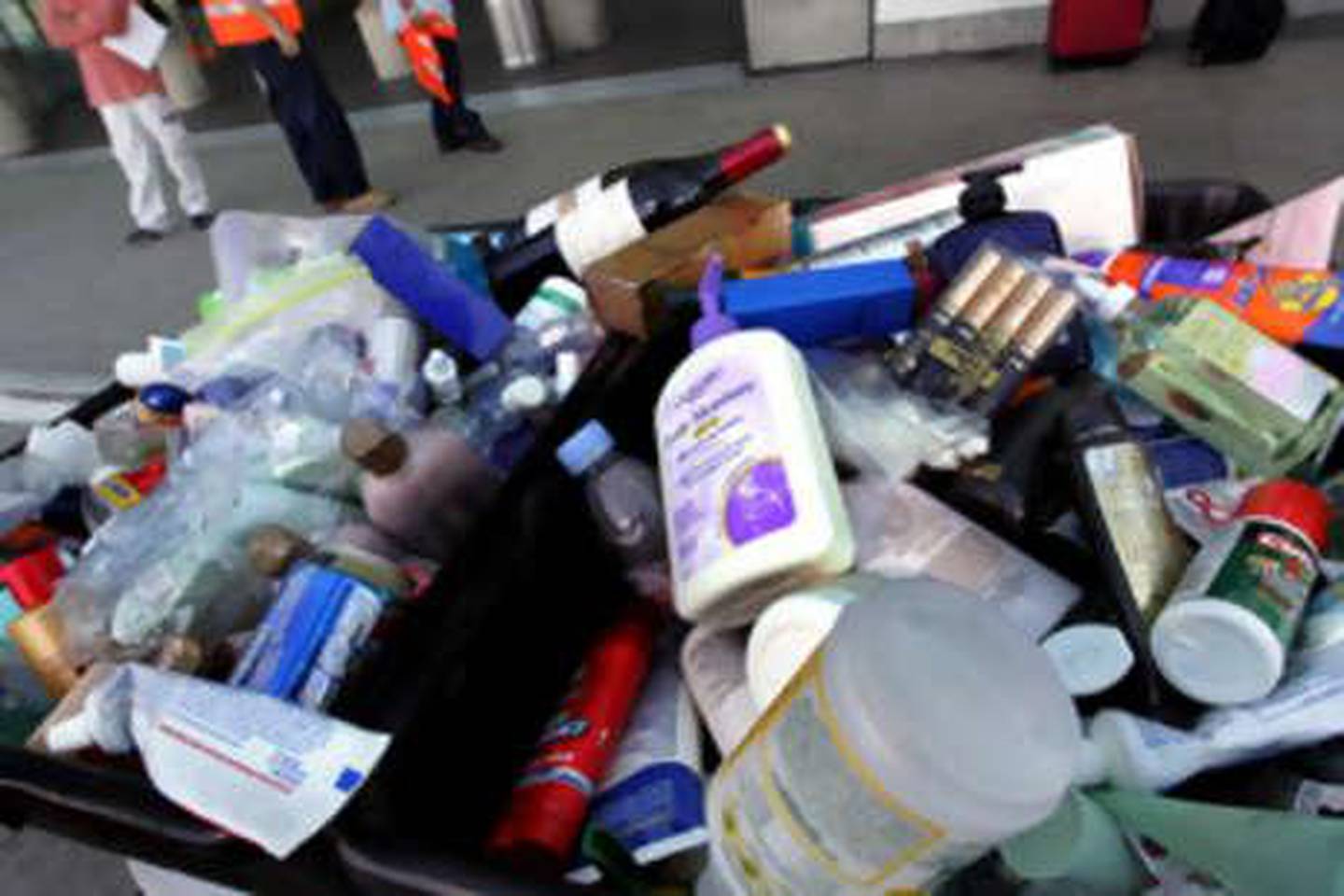 Buckets full of discarded personal items wait to be collected at the Los Angeles International Airport, in Los Angeles, Thursday  Aug 10, 2006. Airport security passed out fliers to passengers of a prohibited item list that included: liquids and gel, beverages, perfume and cologne containers, shampoo, creams toothpaste, hair gels and other items of similar consistency. The United States issued its highest terrorism alert for commercial flights from Britain and raised security for all air travel Thursday after a major terror plot was foiled in London. (AP Photo/Stefano Paltera)