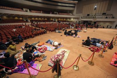 Protesters inside the parliament building in Baghdad. AP Photo