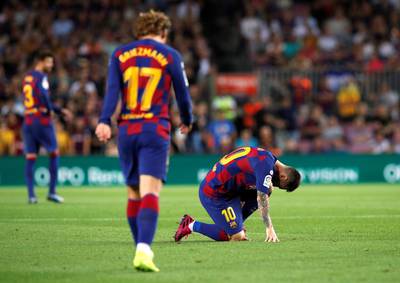 Barcelona's Lionel Messi struggles with the effects of an injury. Reuters