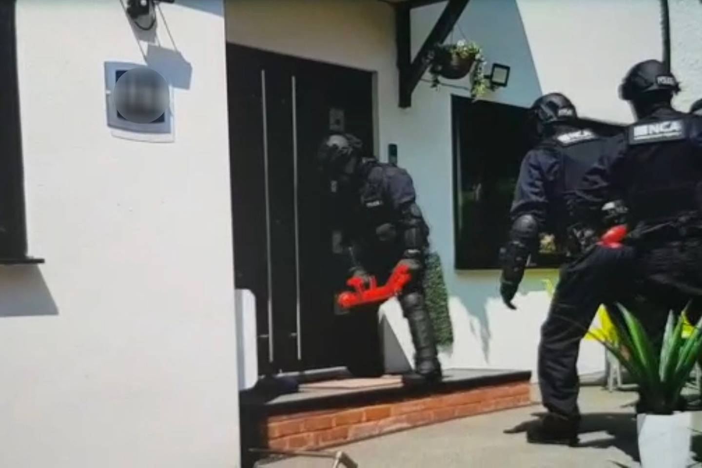 UK police raid suspected people smugglers