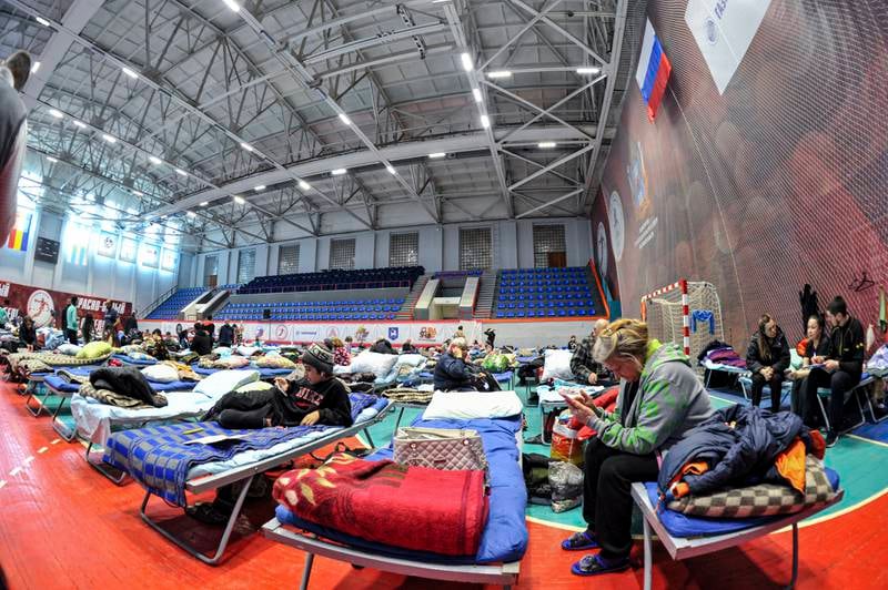 Refugees at a temporary accommodation centre in a school gymnasium in Taganrog, Russia. EPA