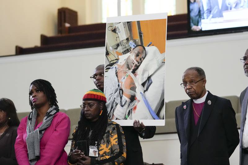 Family members and supporters hold a photograph of Tyre Nichols in Memphis, Tennessee, on January 23. AP
