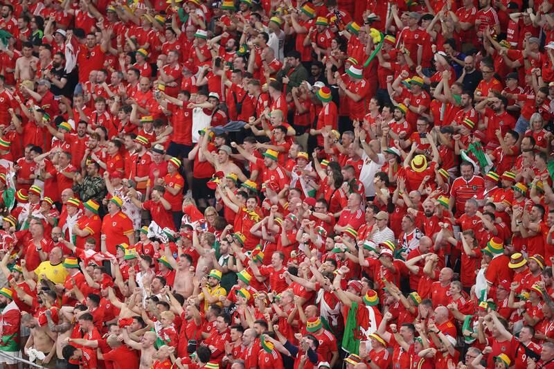 Wales fans cheer their team during its match against USA at Ahmad Bin Ali Stadium. Getty Images
