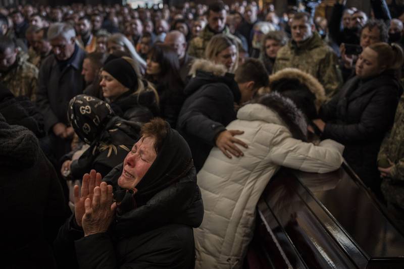 Relatives and friends attend a funeral ceremony in Lviv, Ukraine, for four Ukrainian military servicemen killed during an air strike in Yavoriv on March 15. AP Photo / Bernat Armangue